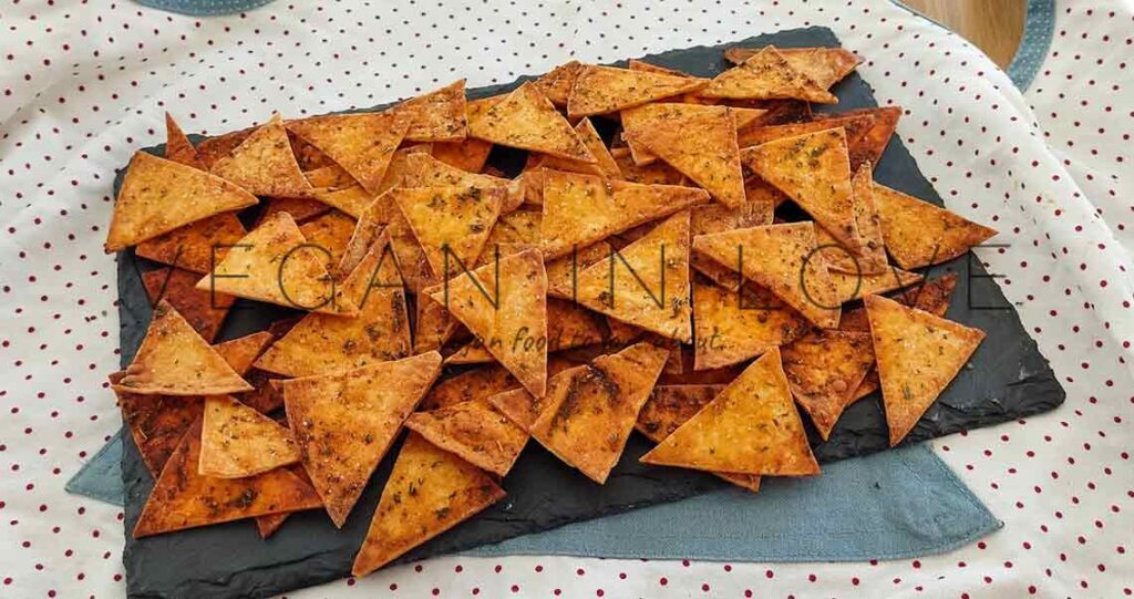 Delicious, quick, simple, & easy to make these baked tortilla chips. They are made with tortilla wraps & with aromatic herbs. Enjoy this recipe as a great snack