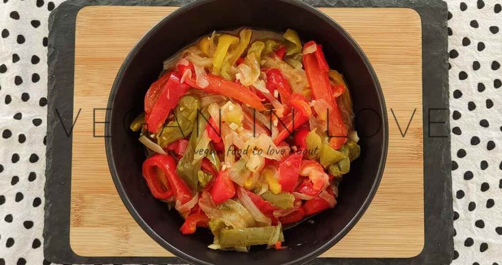 This delicious side dish is super easy and simple to make. Enjoy these sauteed peppers and onions as a great side dish together with vegan burgers and more!